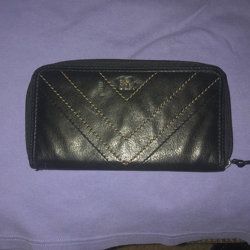 Sak wallet light weight with spots for all your ids and cards.